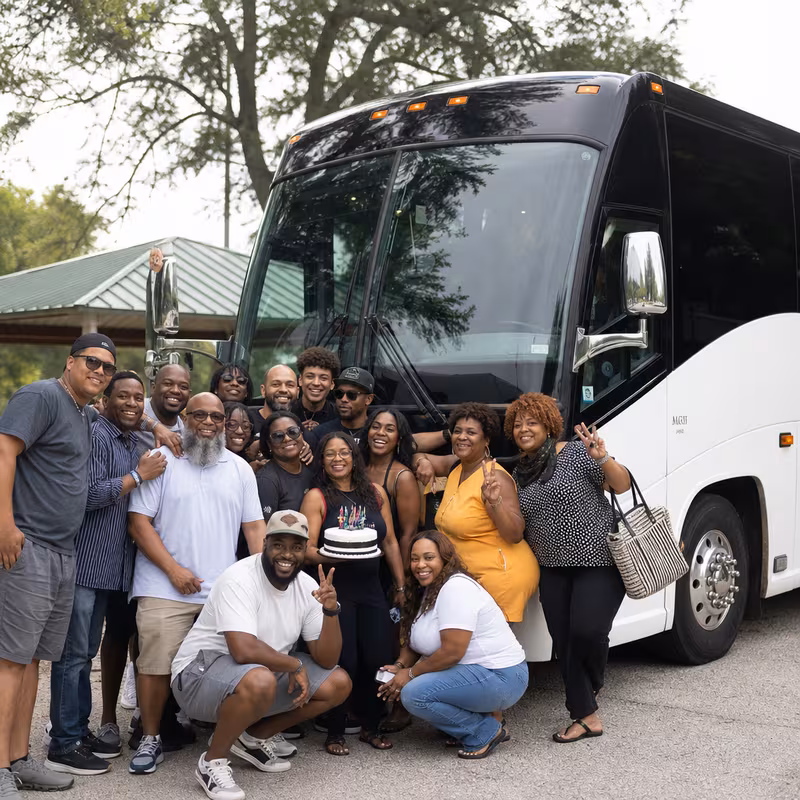 Passengers loading luggage while boarding an Augusta group shuttle