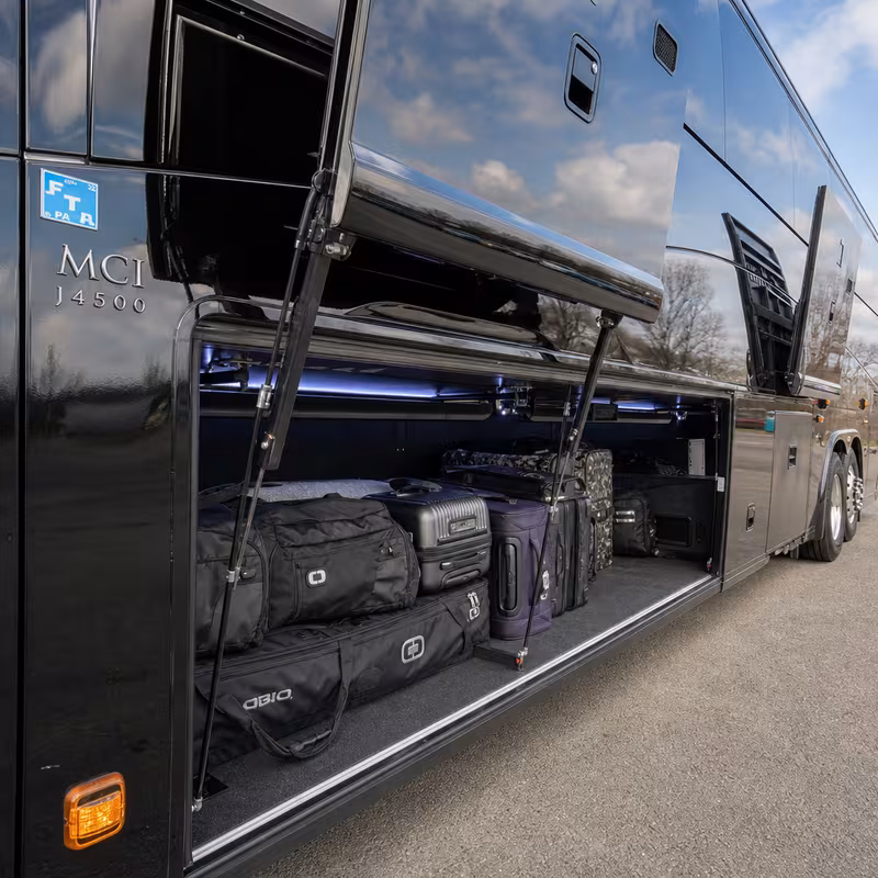 Party bus interior with wraparound leather seating and LED lighting in Augusta